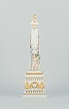 Royal Copenhagen Flora Danica, obelisk for table decoration.
Putti surrounded by garlands, budding flowers