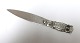 Silver letter knife (830). Owl with green eyes. Length 11.5 cm. Produced 1925.