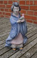 Hjorth Danish stoneware figurine No 531 in blue glaze. Japanese woman carries a bird and the left foot is glued.