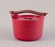 Timo Sarpaneva for Rosenlew, Finland. Cast iron pot in red enamel with a wooden 
handle.