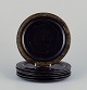 A set of six Japanese plates in papier-mâché. Black lacquerwork with gold 
decoration.