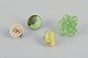 French jewelry artist. Four designer rings in metal and plastic. 
Various designs in green and yellow colors.