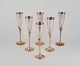 Swedish designer. A set of six champagne glasses in brass and silver-plated 
brass. Handcrafted.