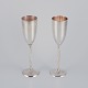 Gunilla Lindahl for Scandia Present, Sweden. Two large champagne flutes in 
plated silver.