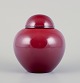 Paul Millet for Sevres, France. Unique lidded ceramic jar with oxblood glaze.