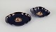 Limoges, France. Two porcelain serving platters adorned with 22-karat gold leaf 
and a beautiful royal blue glaze featuring Scène galante.