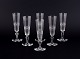 A set of six mouth-blown French champagne flutes in crystal glass. Faceted cut. 
Handmade.
