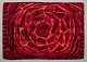 Swedish textile designer. Handmade rya carpet of pure cotton. Red, orange, and pink colors.