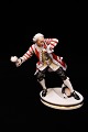 Bing & Gröndahl porcelain figure by Jens Jacob Bregnö & Hans Tegner.
"footman with coat throws snowball"...