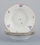 Royal Copenhagen Saxon Flower. Four deep plates in porcelain. Hand-painted with 
polychrome flowers. Gold rim.