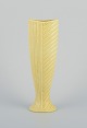 Gunnar Nylund for Rörstrand. Ceramic vase in chamotte clay.
Rare shape. Yellow glaze.