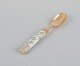 Royal Copenhagen Flora Danica/Georg Jensen. Dining spoon, hand-painted with 
Flora Danica motif. Handle by Georg Jensen in gilt sterling silver.