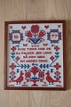 An old Sampler, handmade embroider, in the 
original frame
Text: "Hvis tiden hos os ej falder jer lang, så 
kom igen en anden gang" (= If you don´t find the 
time by us too long, please come again another 
time) 
1977
Measure incl. the frame: 46cmx41cm
In