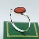 N. E. From; 
Bangle of 
sterling silver 
with amber