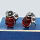 N. E. From; A 
pair of amber 
ear rings set 
in sterling 
silver