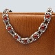 N. E. From; A 
necklace of 
sterling silver 
with amber