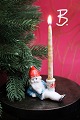 Gammel 
julelysestage i 
bemalet biskuit 
af liggende ...