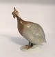 Royal 
Copenhagen. 
Porcelænsfigur. 
Perlehøne. 
Model 1086. ...