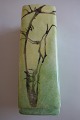 Vase made of chinaDecoration made by handL: 15cmIn a very good condition