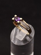 14 carat gold ring with amethyst and several small diamonds