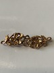 14 Karat guld 
broche med 
blomster