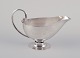 L'Art 
præsenterer: 

Johan 
Rohde 
(1856-1935) for 
Georg Jensen. 
Sovsekande af 
sterlingsølv. 
Hammerslået 
kande med ...
