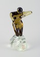 L'Art 
præsenterer: 

Cenedese, 
Murano, 
Italien.
Stor skulptur 
af kunstglas. 
Nøgen kvinde på 
klippe.