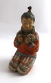 Royal Copenhagen. Overglasur figur af Grønlandsk pige. Model 12415. Højde 14,5 
cm. (1 sortering)