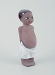 L'Art presents: 
Mari 
Simmulson for 
Upsala Ekeby.
Figure of a 
child. Glazed 
stoneware.