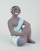 L'Art presents: 
Mari 
Simmulson for 
Upsala Ekeby.
Figure of an 
oriental woman. 
Glazed 
stoneware.