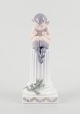 L'Art 
præsenterer: 

Royal 
Copenhagen, 
figur af 
porcelæn.
Fløjtende Pan 
siddende på 
sokkel med 
salamander.