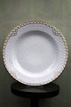 Rare Royal Copenhagen deep plate in Princess with gold decorations. 
from 1893-1900...