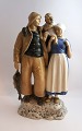 Lundin Antique 
præsenterer: 
Bing & 
Grøndahl. 
Porcelænsfigur. 
Fisker familie. 
Model 2025. 
Højde 31 cm. (1 
...