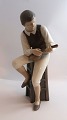 Bing & Grøndahl. Porcelænsfigur. Mandolinspiller. Model 1600. Højde 28,5 cm. (1 
sortering).