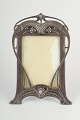 L'Art 
præsenterer: 

WMF 
(Württembergische 
Metallwarenfabrik), 
Tyskland, 
elegant Art 
Nouveau 
tin-ramme, ca. 
1900.