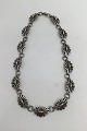 Danam Antik 
præsenterer: 

Georg 
Jensen Sterling 
Sølv /18 kt 
Guld Halskæde 
No. 394