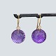 Ole Lynggaard; 
earrings of 18k 
gold set with 
amethyst ...