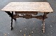 Pegasus – Kunst 
- Antik - 
Design 
presents: 
Antique 
long table with 
carvings and 
drawer, 19th 
century.