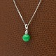A necklace in 14k white gold set with diamond and jadeite