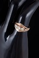 L'Art presents: 14 carat gold ring with three colourless stones.