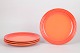 L'Art presents: Le Creuset, set of four dinner plates.