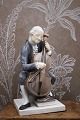 K&Co. præsenterer: Bing & Grøndahl figur af en cellist i ført rokoko tøj...