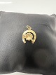 Antik Huset præsenterer: 14 karat guld. Hestesko med en Firkløver. Charms / Vedhæng.Højde 1,8 cm.