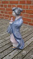 Hjorth Danish stoneware figurine No 531 in blue glaze. Japanese woman carries a bird and the left foot is glued.