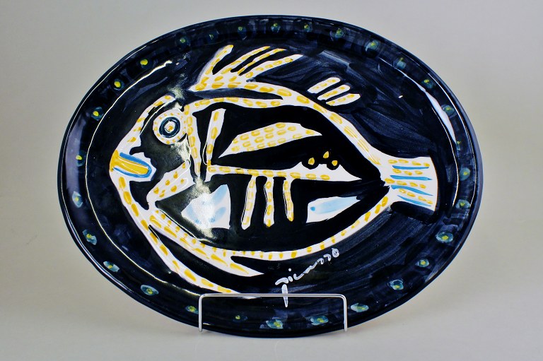 Large Pablo Picasso platter in art pottery decorated with a fish.