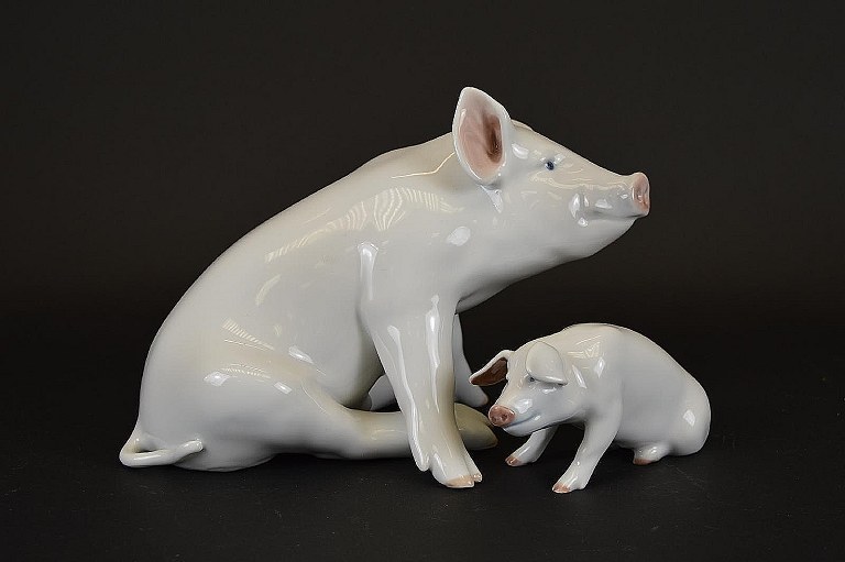 Royal Copenhagen pig, number 1400 and 414.
