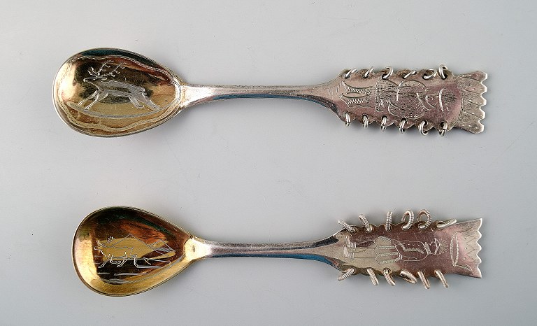 2 Sami/Lapps spoons in silver. Motif of moose and man in national costume.