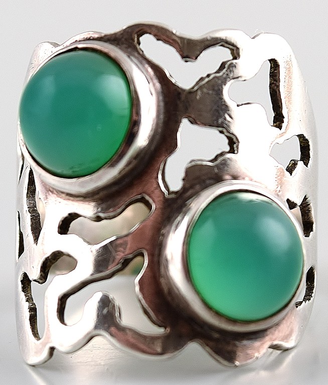 Silver ring with green stones.