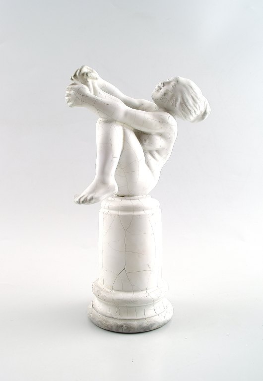 "Cinderella" figure in white glazed earthenware. Kai Nielsen. Signed HAK, 
Denmark. Produced at Kähler.