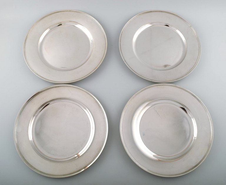 Four Evald Nielsen, Denmark cover plates in hammered sterling silver.
